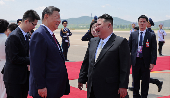 Xi Jinping Kim Jong Un laugh